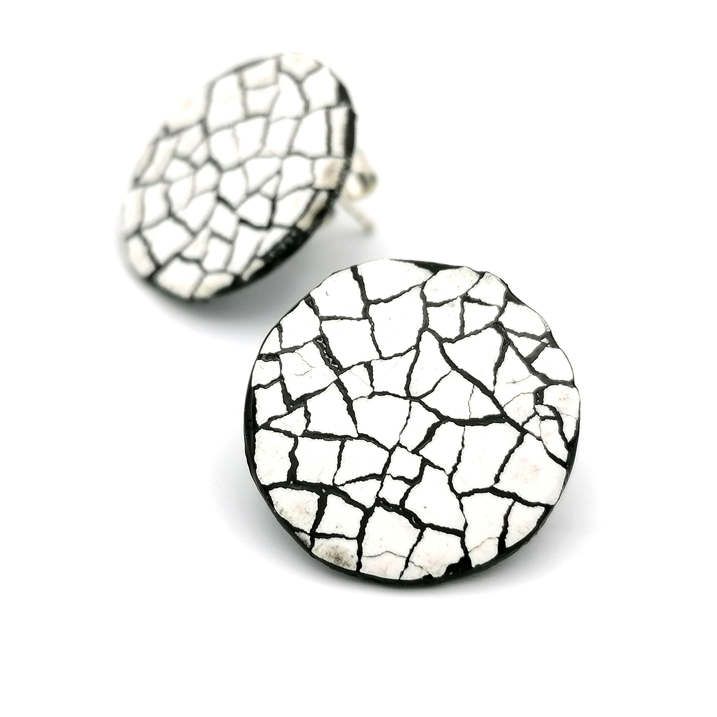 Image shows two round stud modern mosaic earrings made using the Rankaku technique using real eggshell, white on black