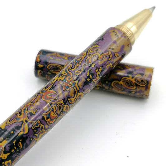 Tambo Solid Brass Pen in purples oranges and yellows
