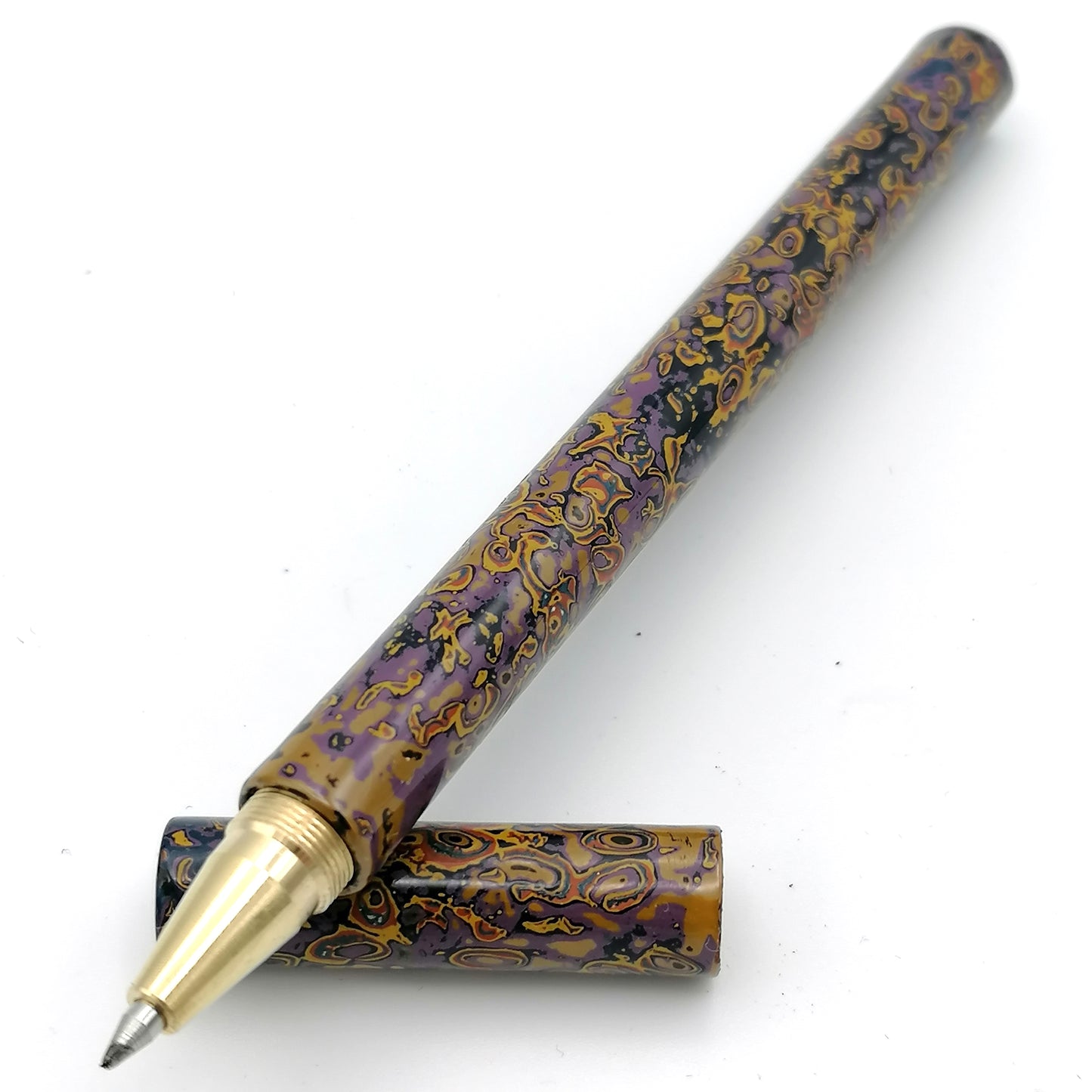 Tambo Solid Brass Pen in purples oranges and yellows